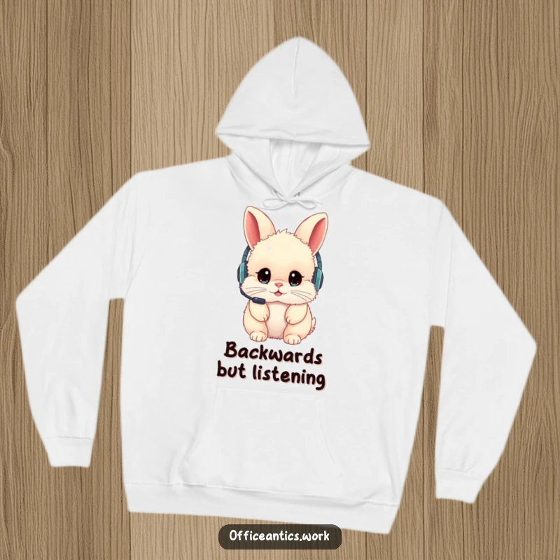 Funny hoodie showing a fluffy rabbit with a backward headset, offering cozy humor and relatable tech struggles.