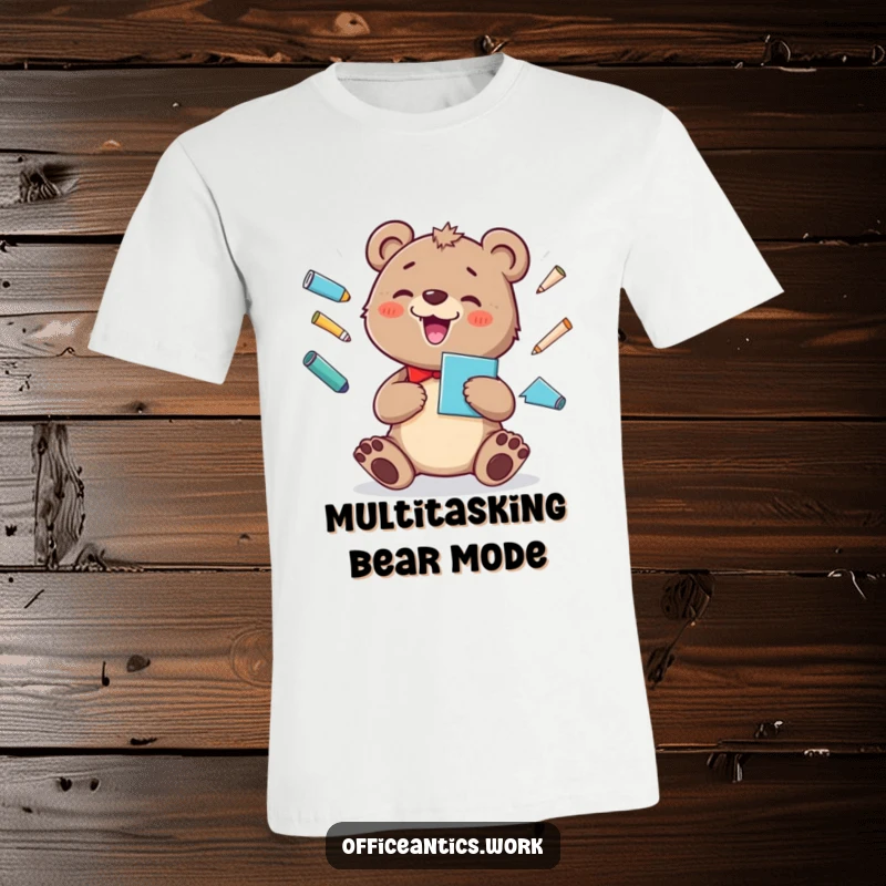 Funny t-shirt of a cheerful bear cub juggling office supplies like pens and a stapler with a silly grin.